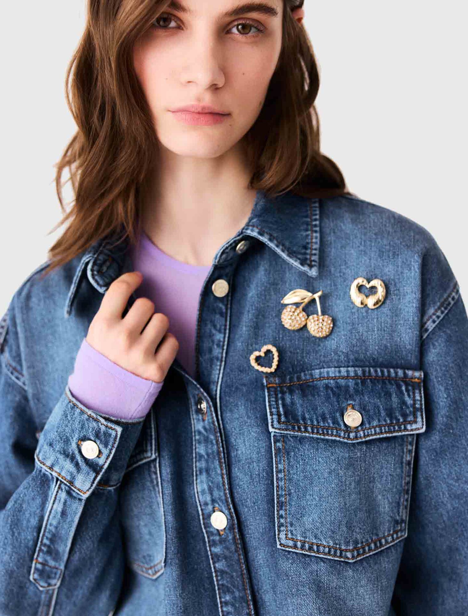Denim shirt with brooches