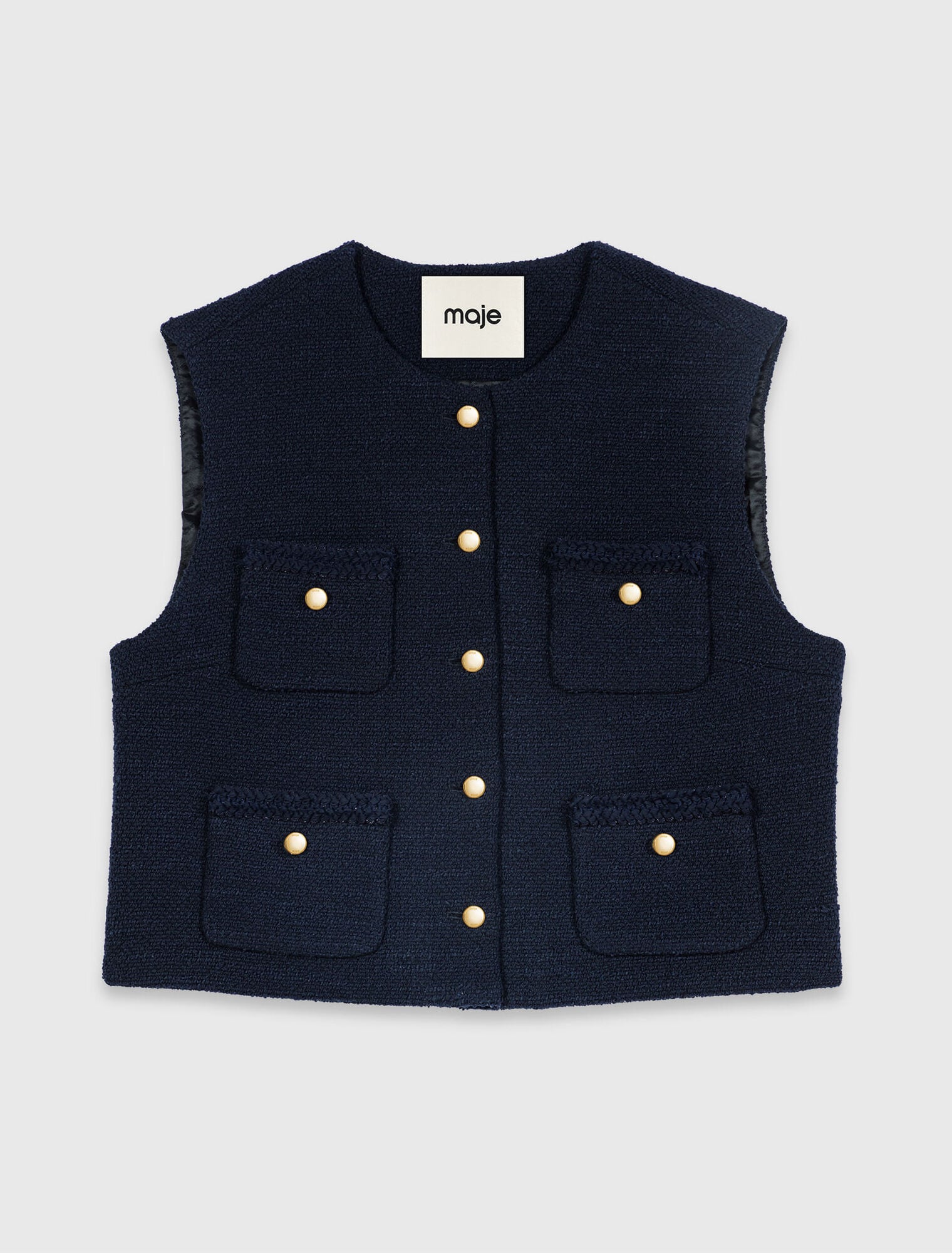 Sleeveless tweed jacket