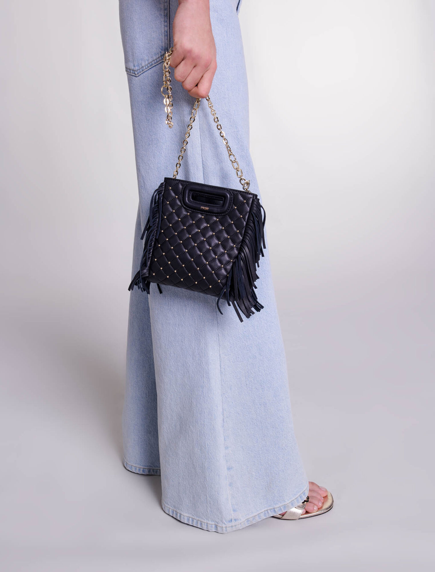 Studded M quilted leather mini bag