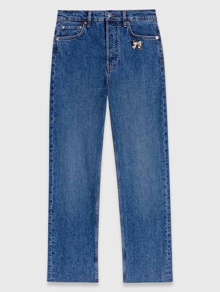 Skinny jeans with brooch