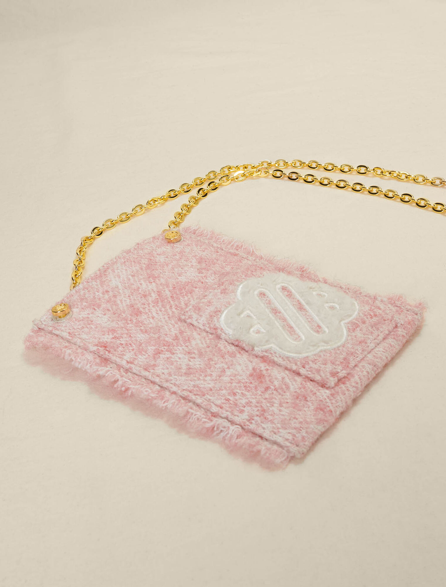 Pink tweed-effect phone bag