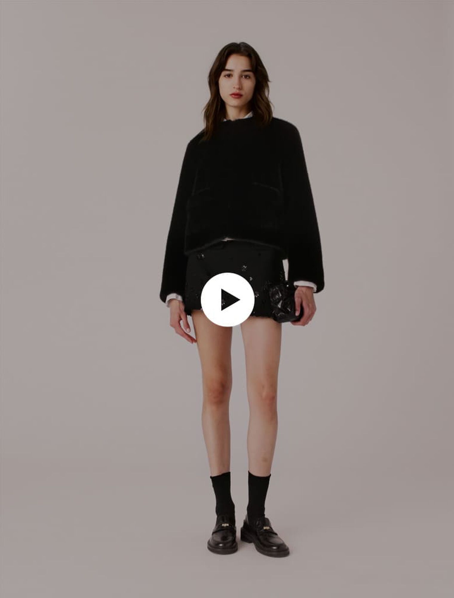 Manteau court en fausse fourrure