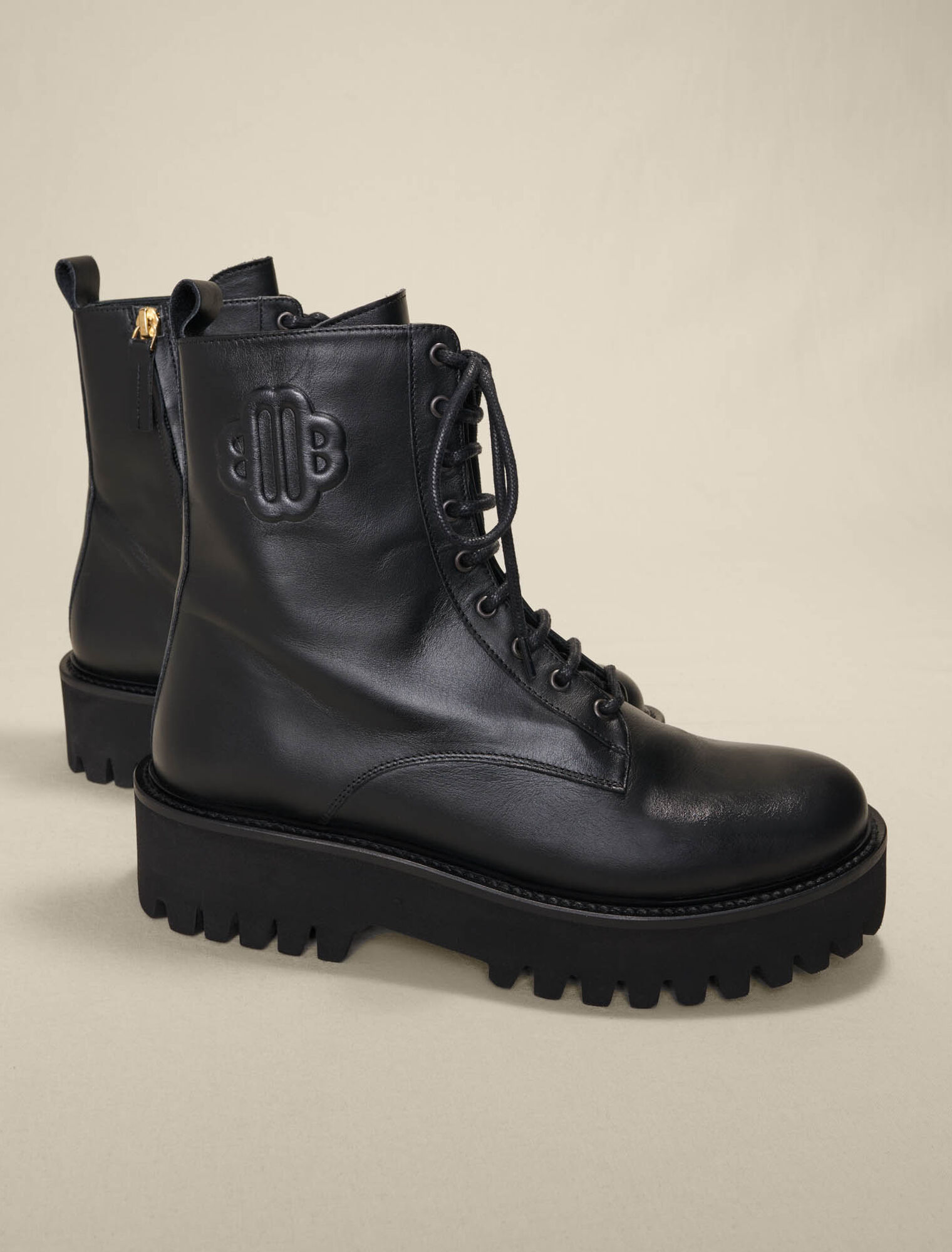 Black leather lace-up boots
