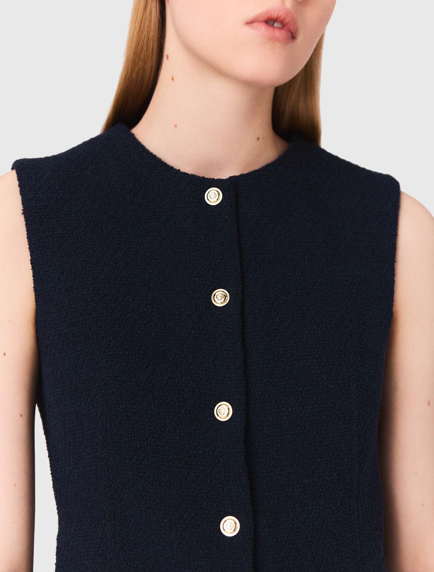 Sleeveless tweed jacket
