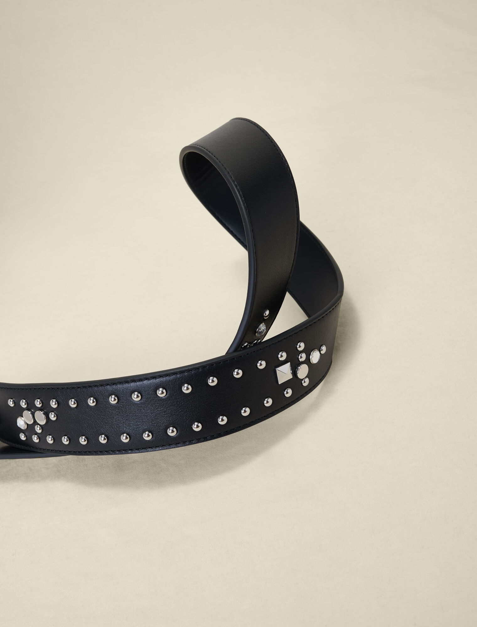 Studded leather shoulder strap