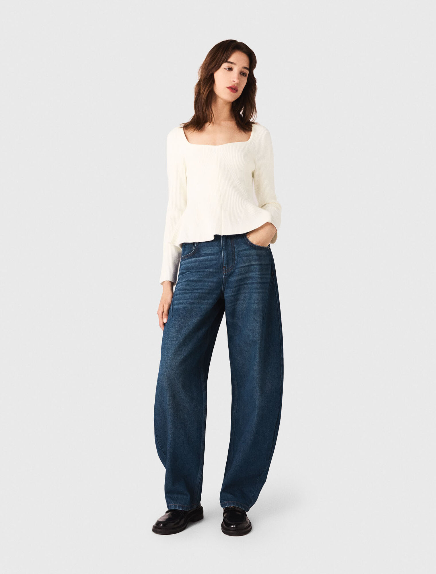 Pull en maille à taille péplum