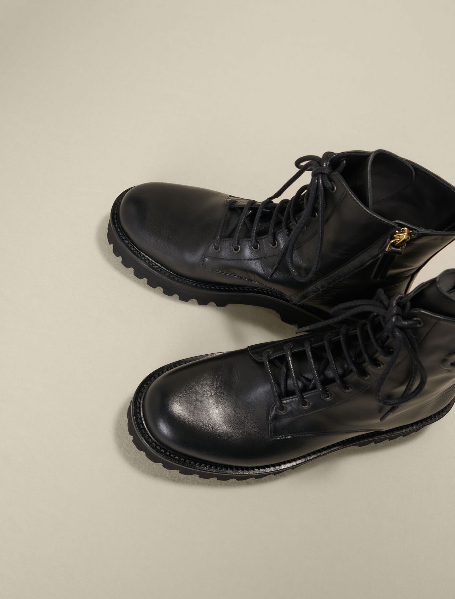 Black leather lace-up boots