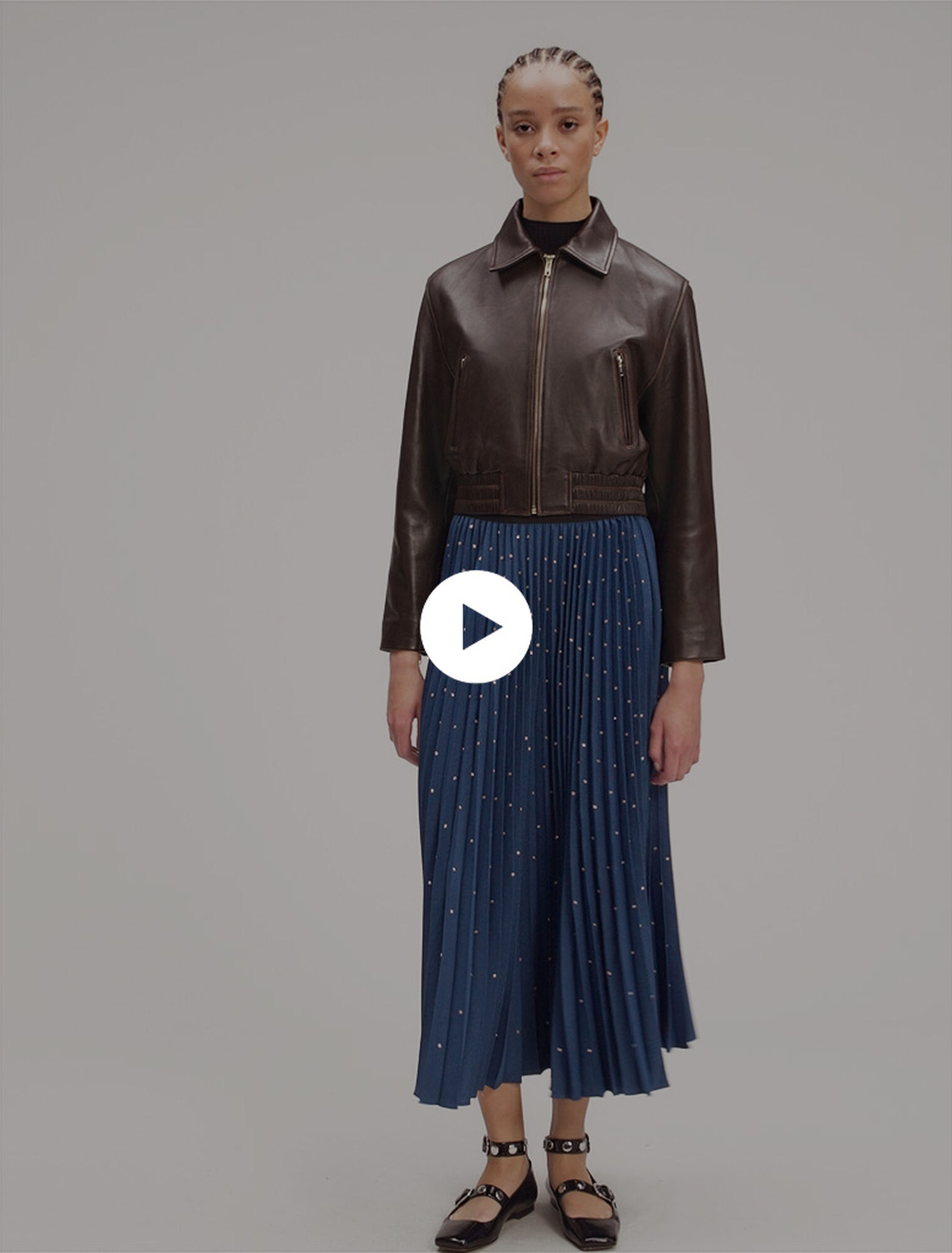 Jupe longue plissée à studs