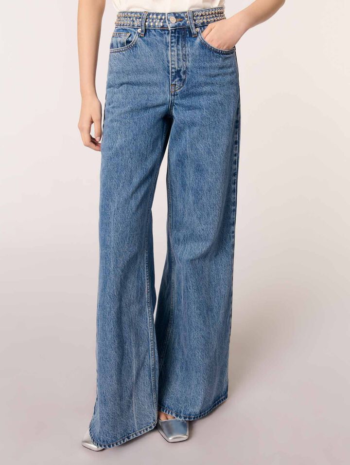 Flared jeans with studded waistband