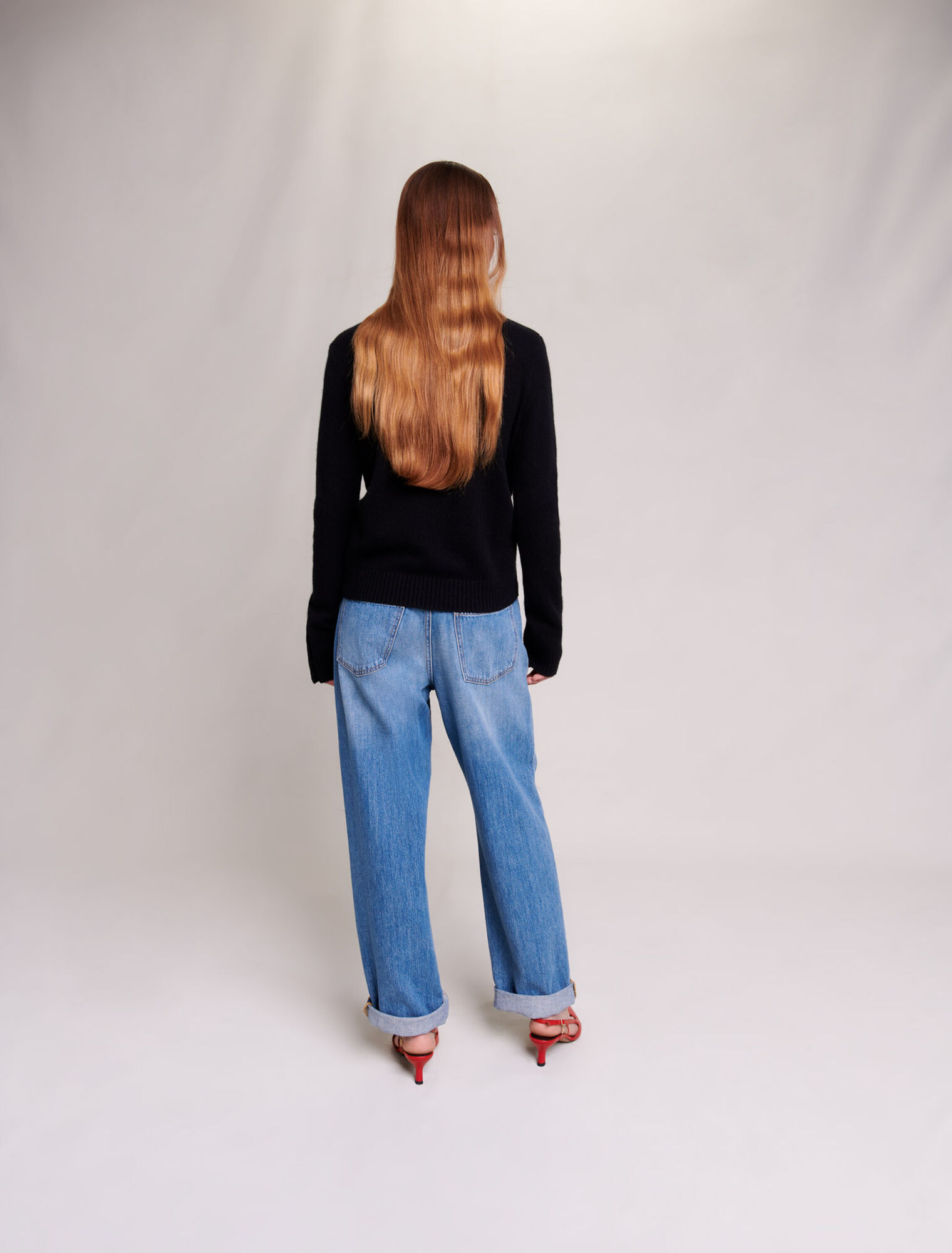 Cashmere sweater with gold snap buttons