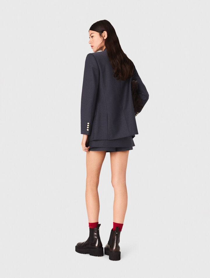 Veste tailleur à boutons dorés