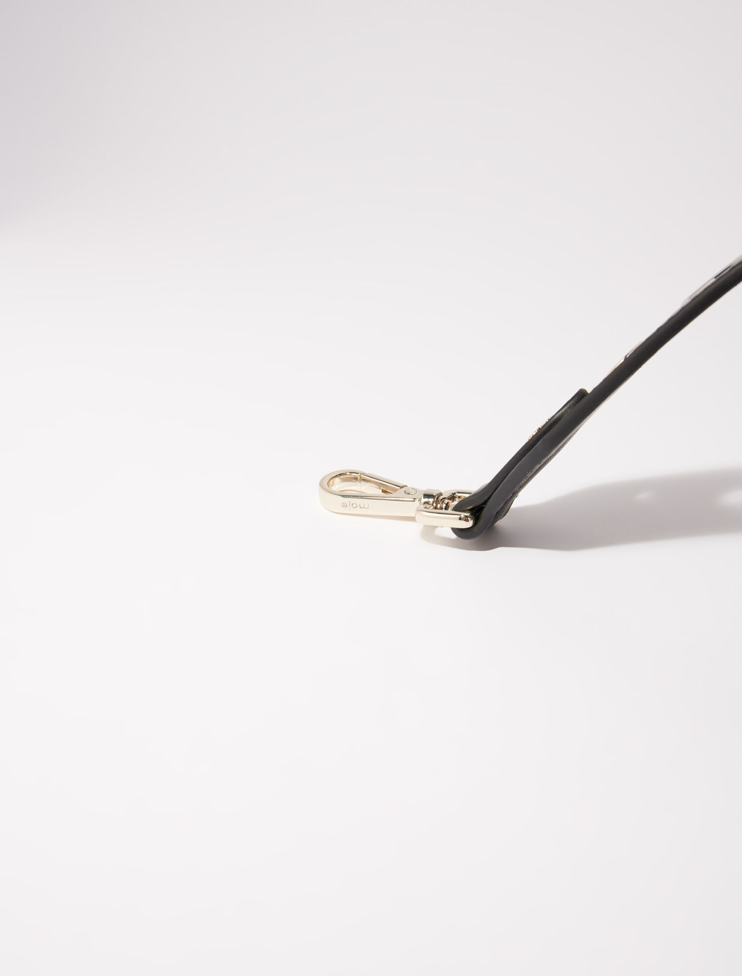 Leather shoulder strap with eyelets