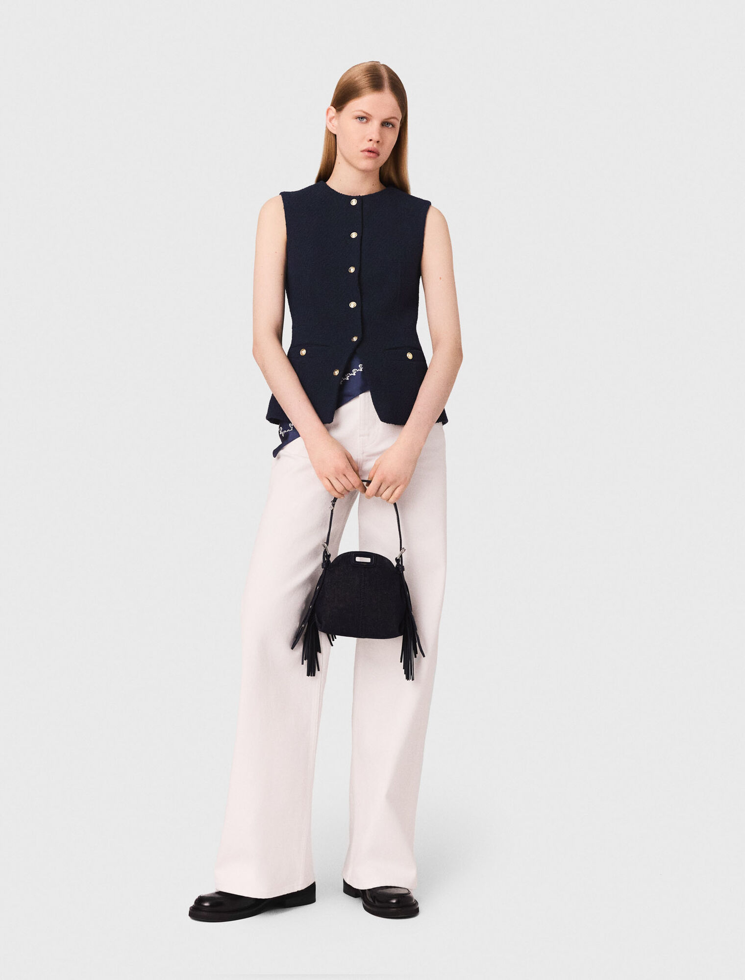 Sleeveless tweed jacket