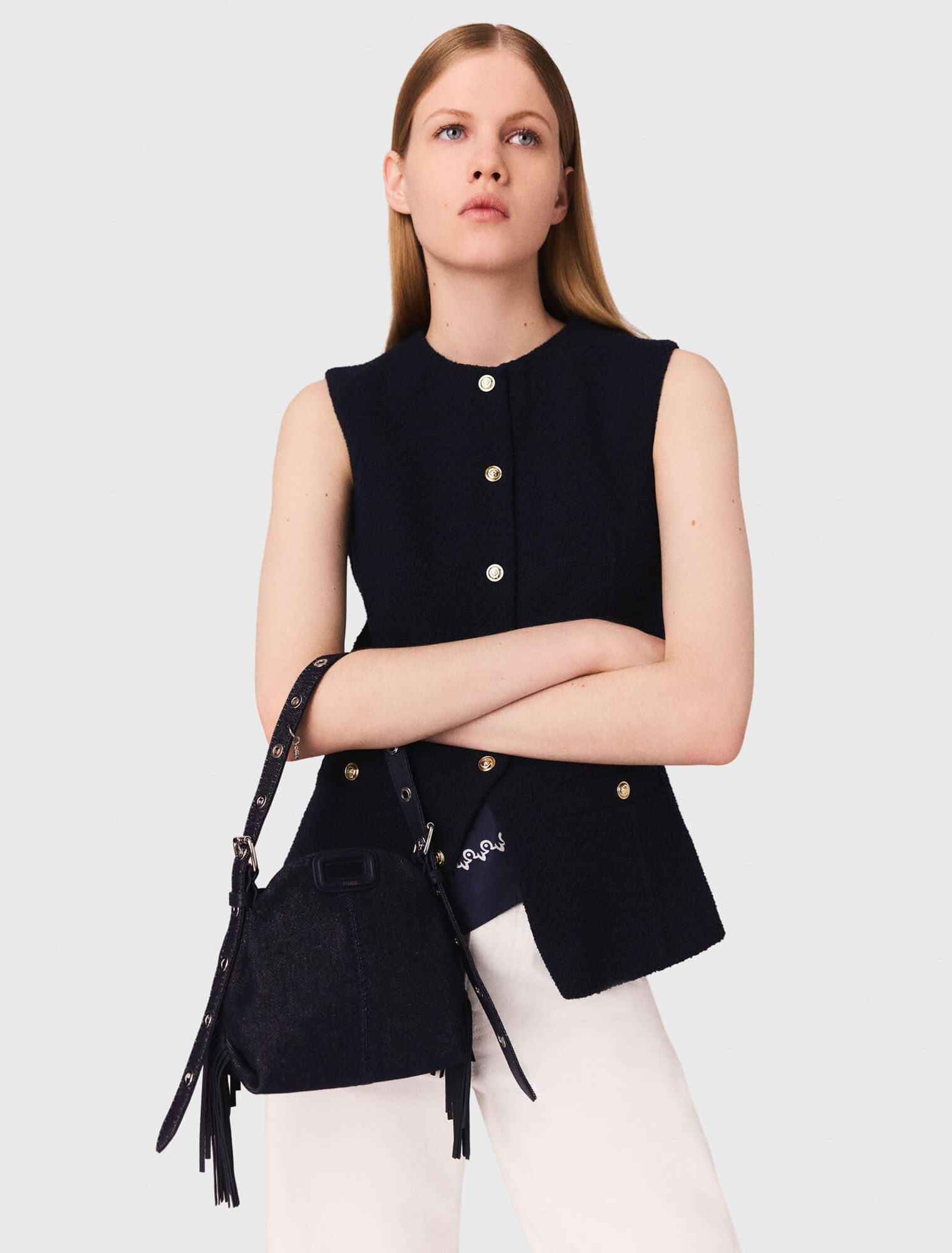 Sleeveless tweed jacket