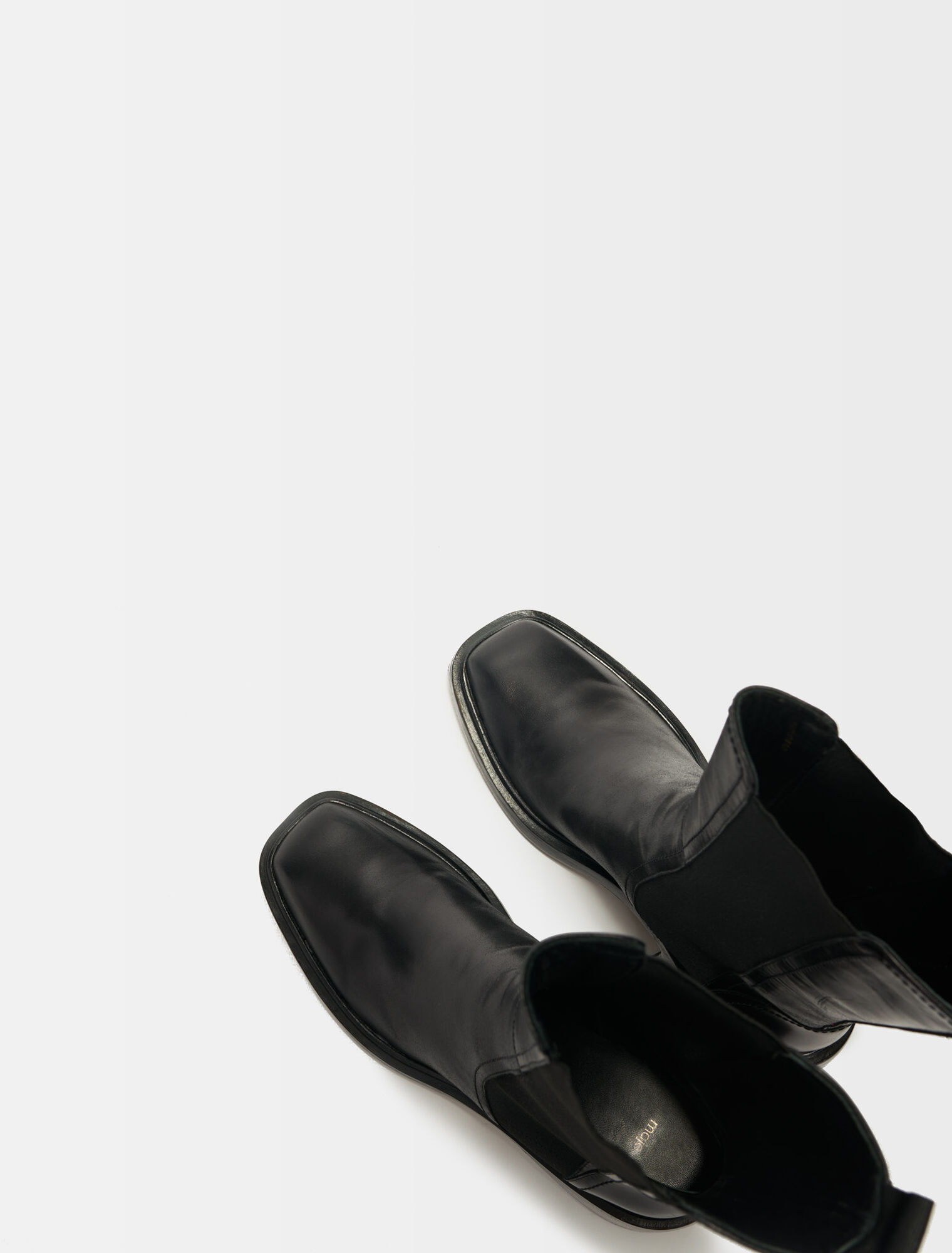 Black leather ankle boots and square toe