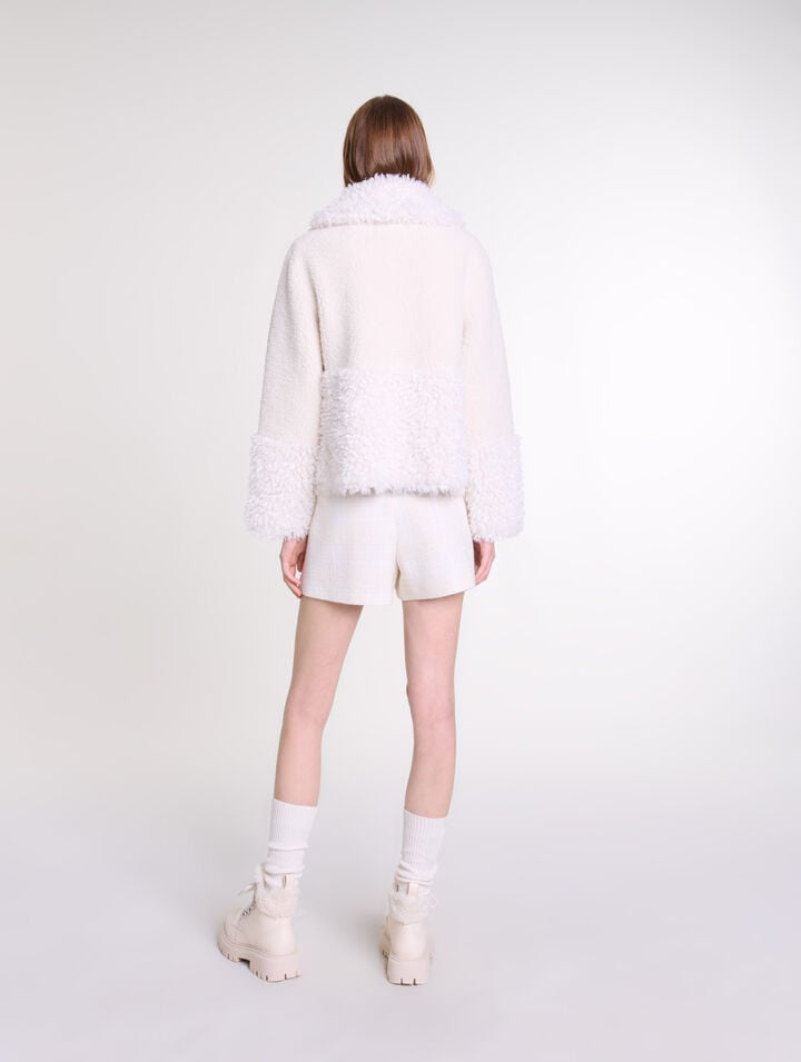 Manteau court fausse fourrure