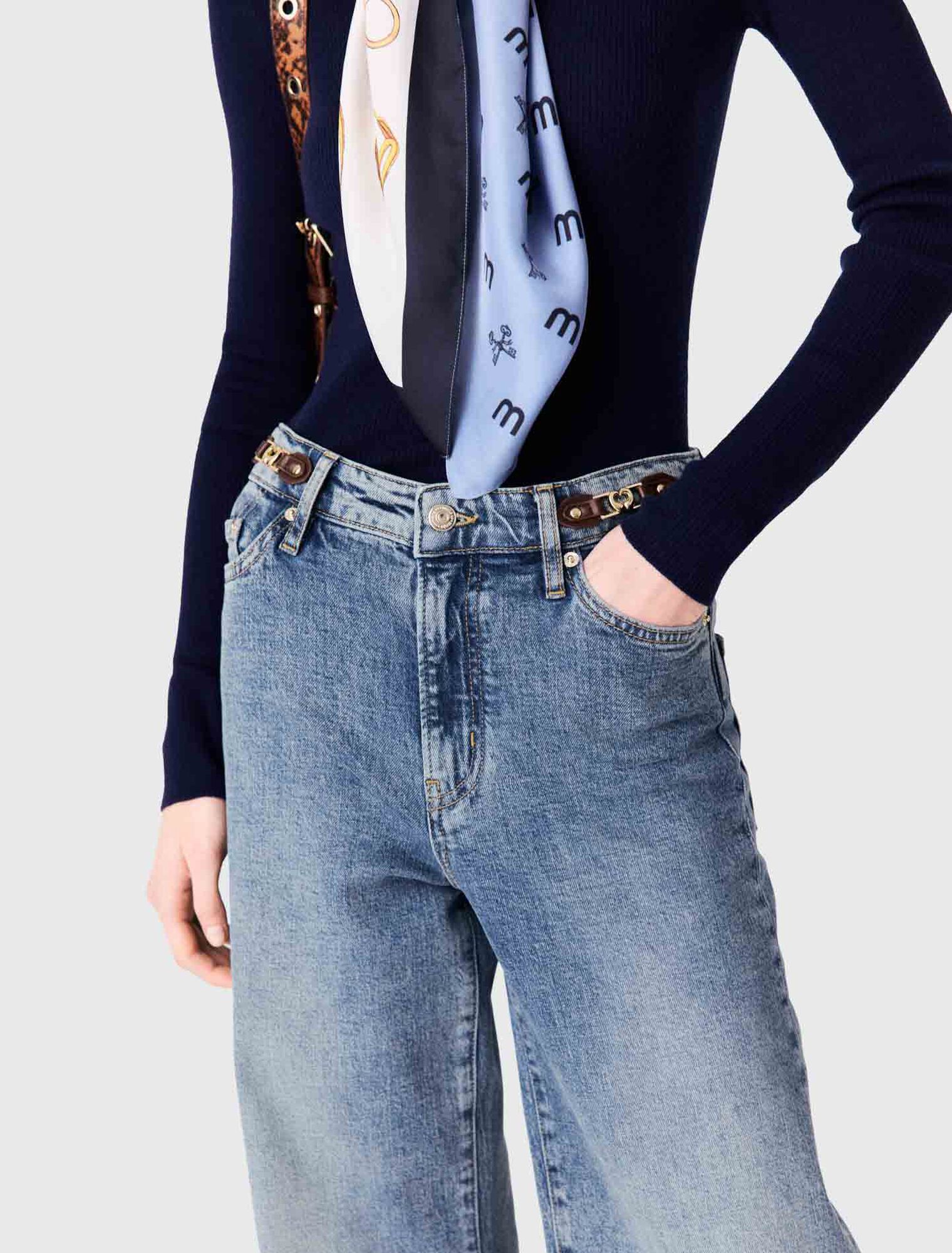 Jean large avec boucles en cuir