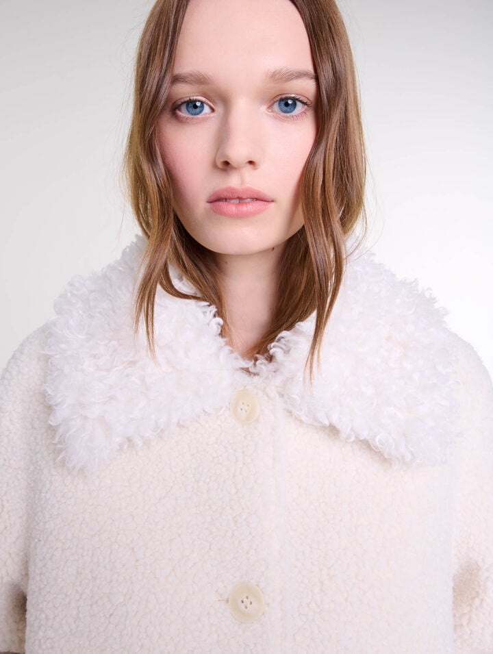 Manteau court fausse fourrure