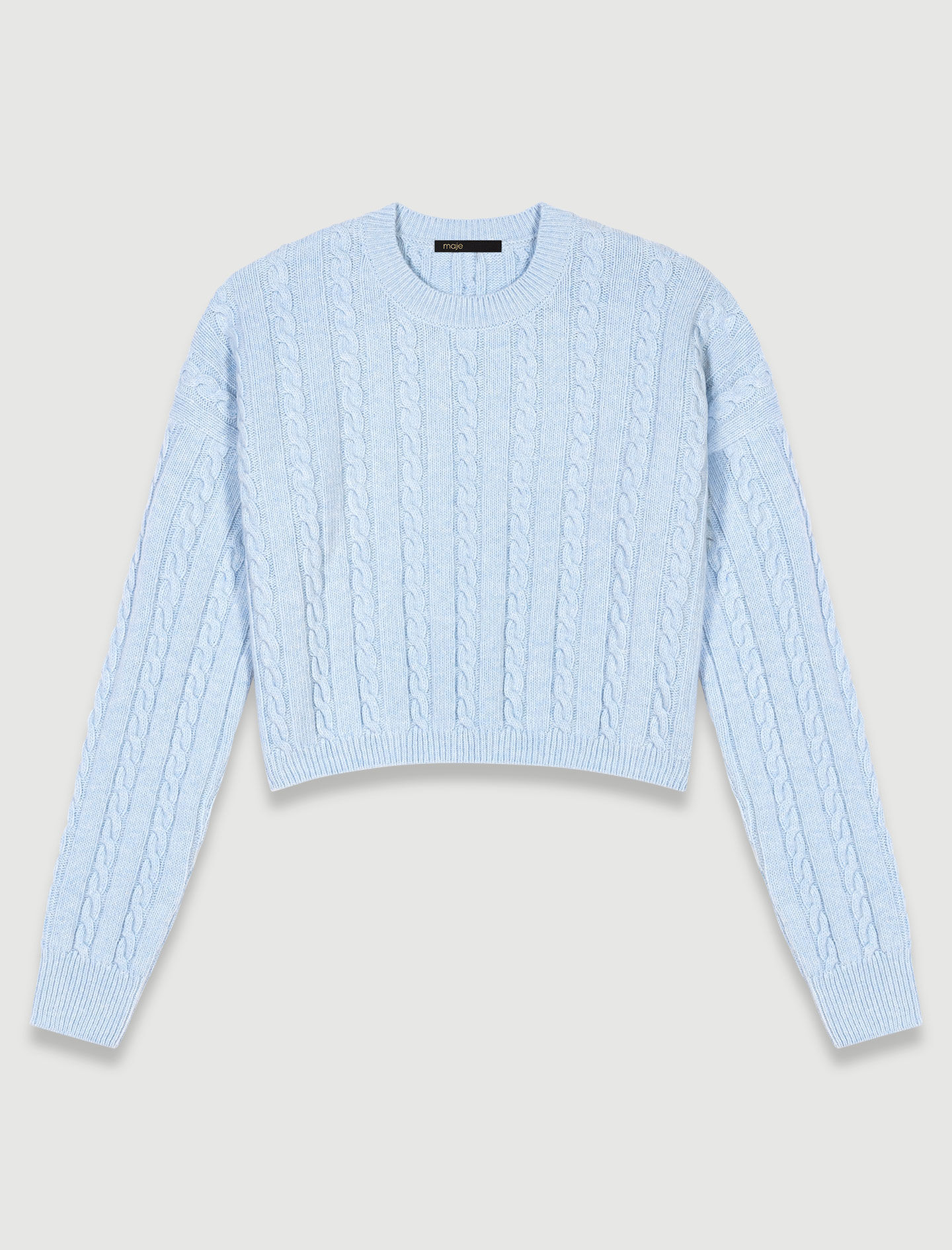 Short sweater in cable knit