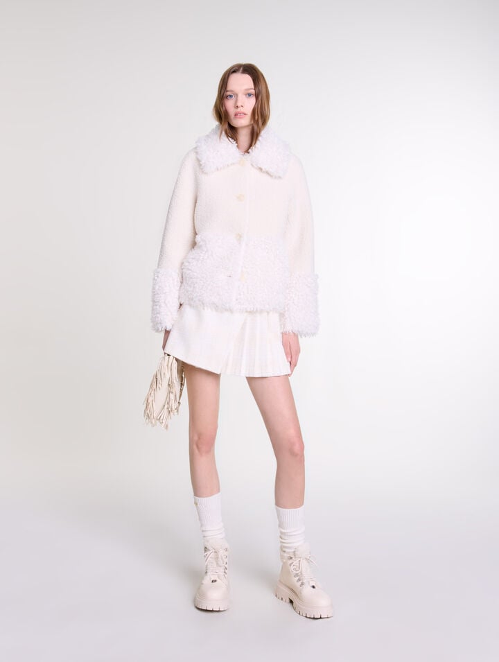 Manteau court fausse fourrure