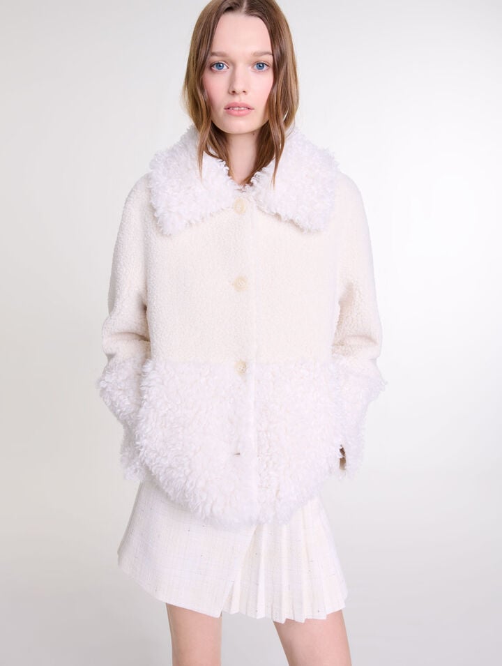 Manteau court fausse fourrure