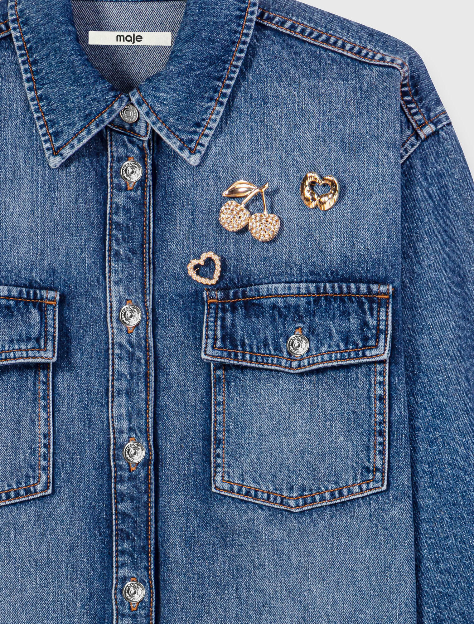 Denim shirt with brooches