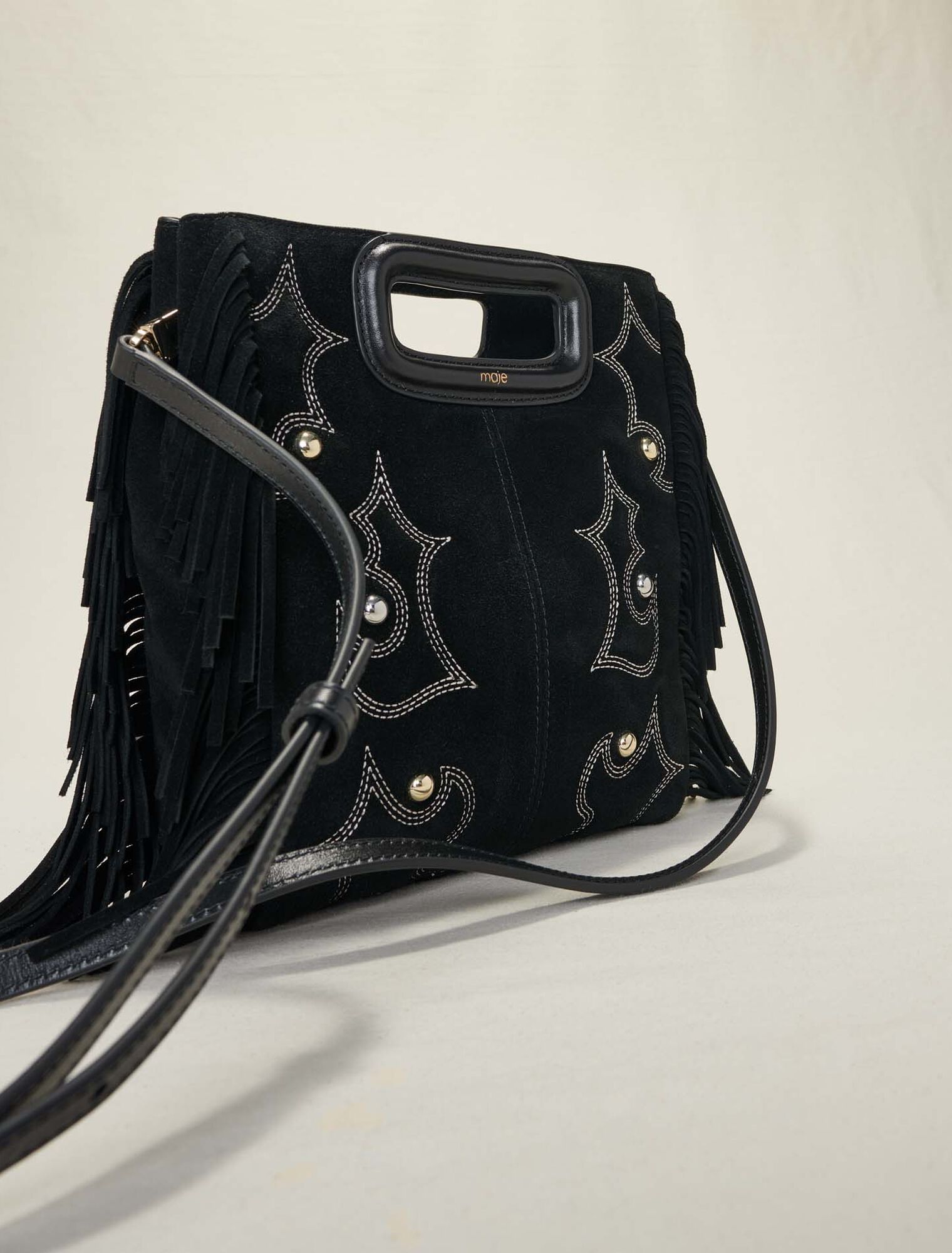 Embroidered studded leather M bag