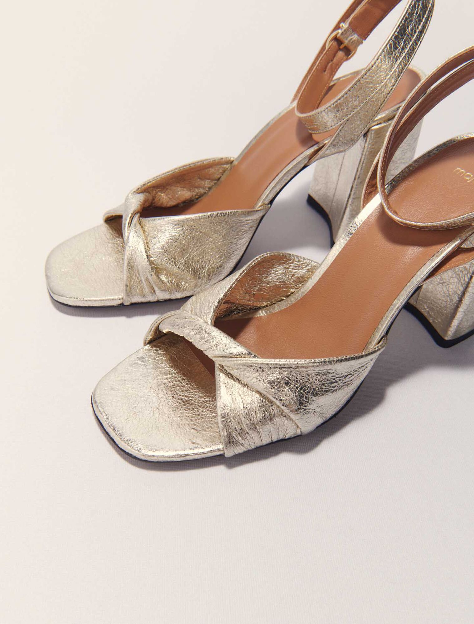 Metallic leather sandals with heels