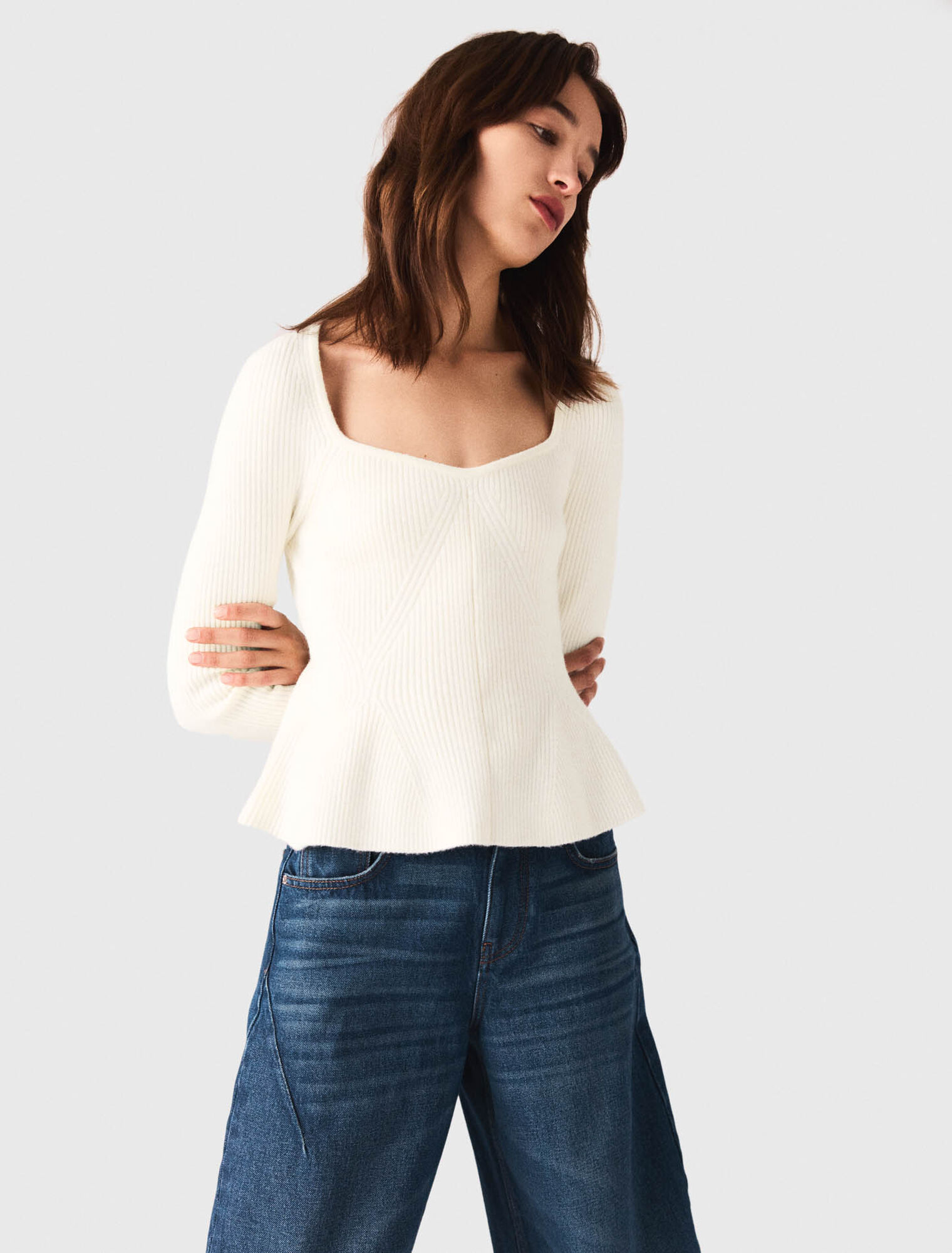 Pull en maille à taille péplum