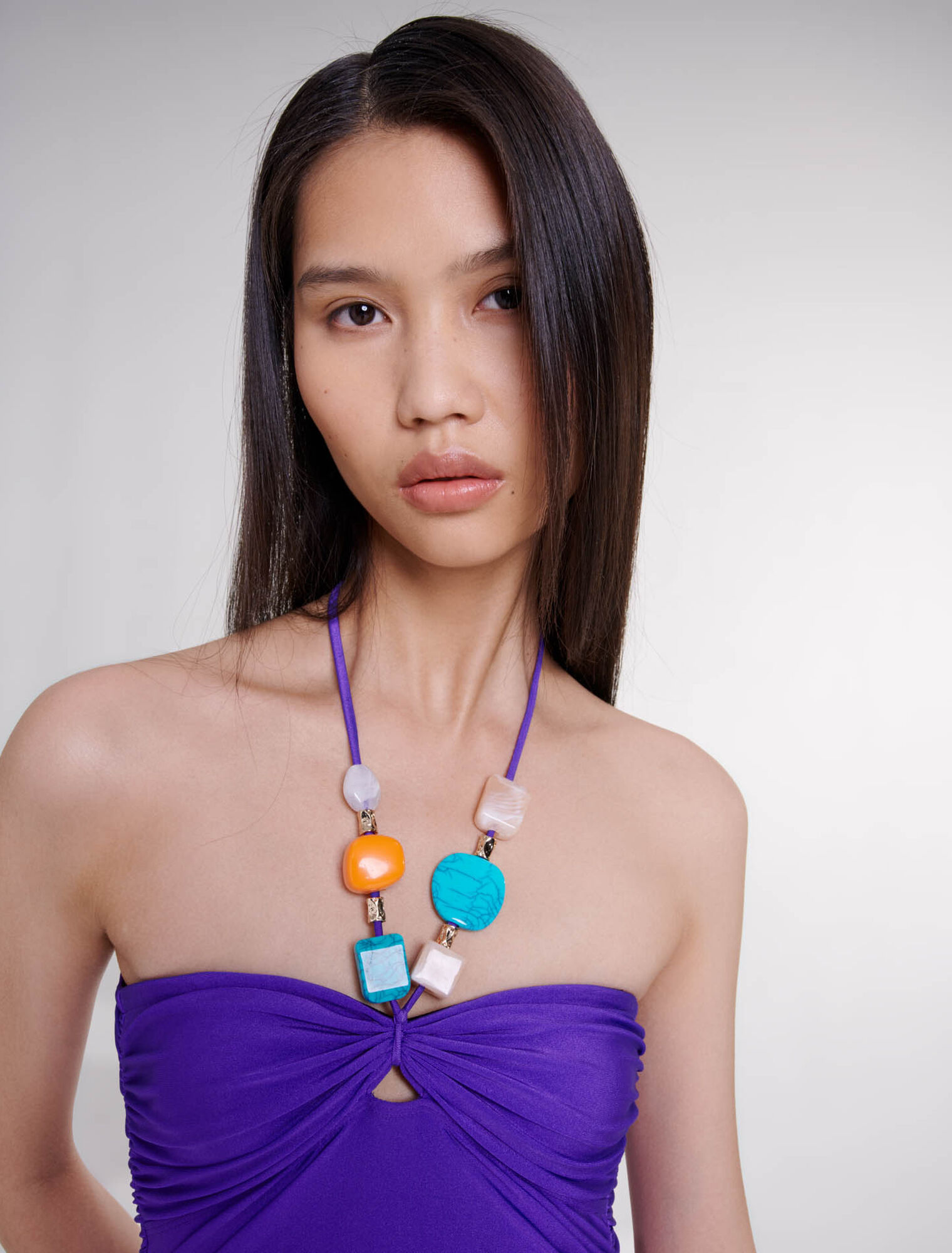 One-piece swimsuit with jewellery