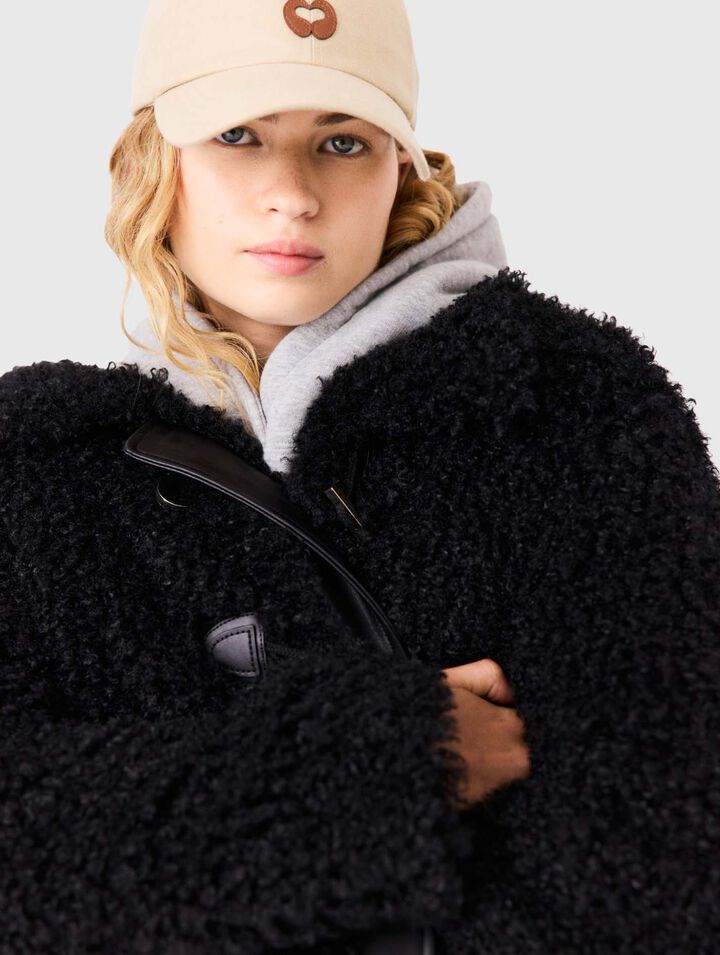 Blouson en fausse fourrure boucl&eacute;e