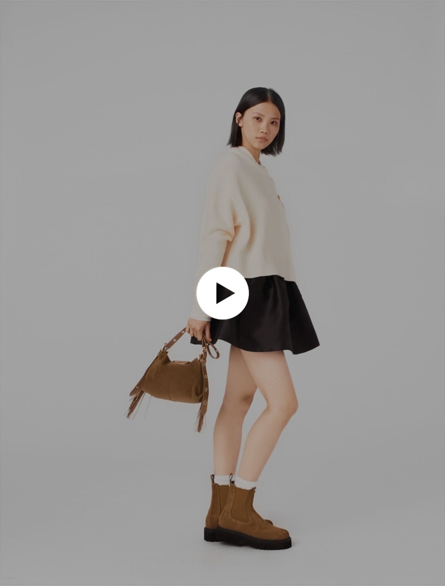 Sweater with floral brooch