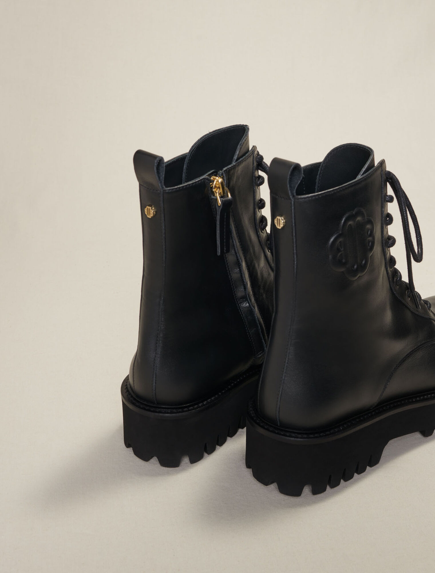 Black leather lace-up boots